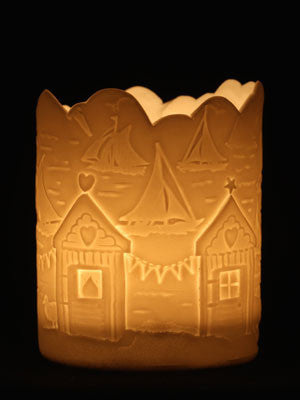 Porcelain Tealight holder with seaside scenery of sailing and beach huts.