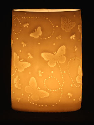 butterflies attracted to the light of the candles porcelain tealight holder handmade by stefstorey